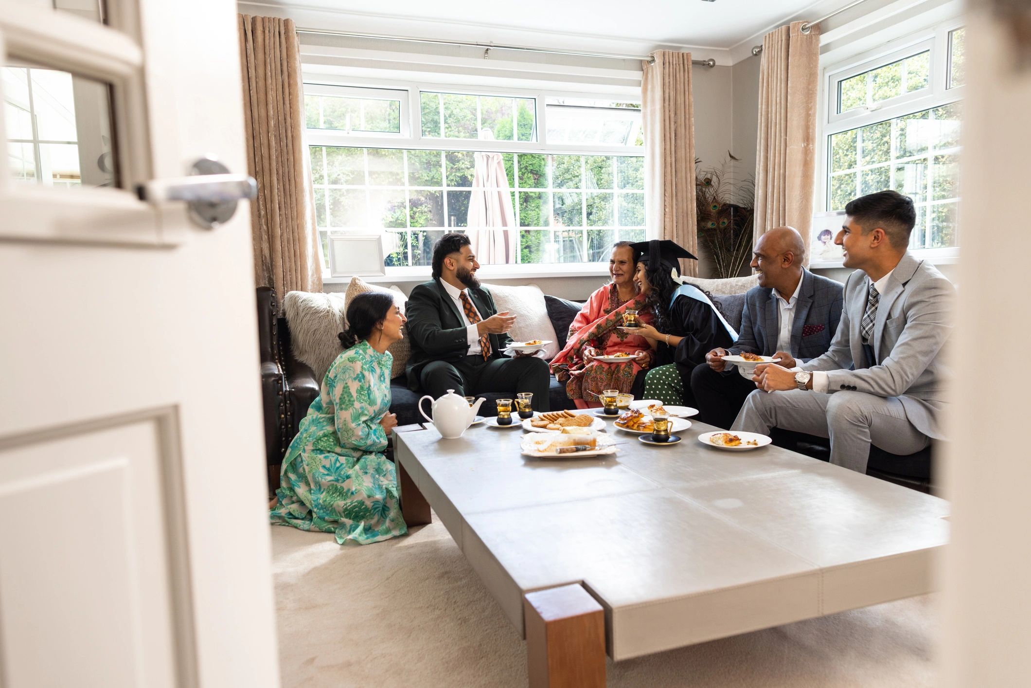 Family gathered together in a warm home setting