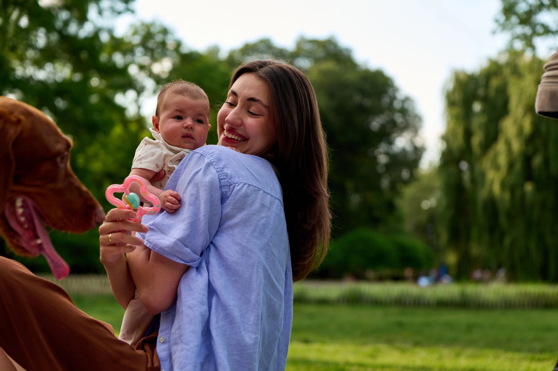 Mother holding baby outdoors